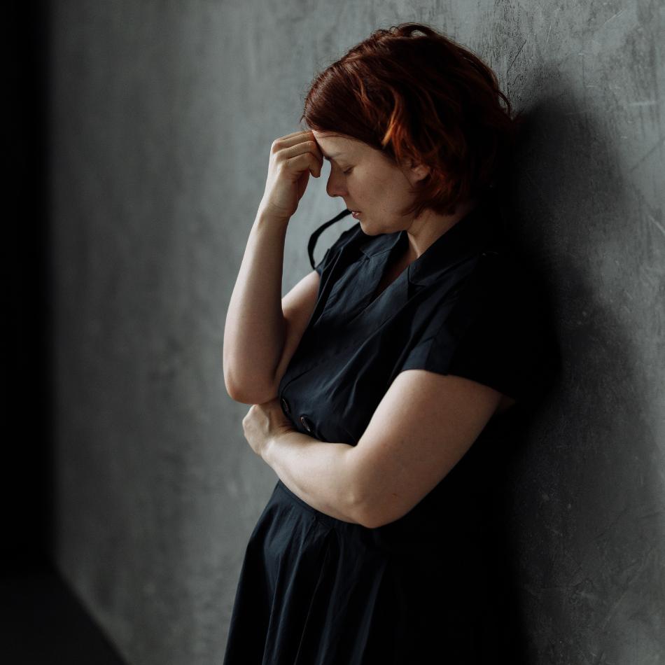 woman stressed in dark room