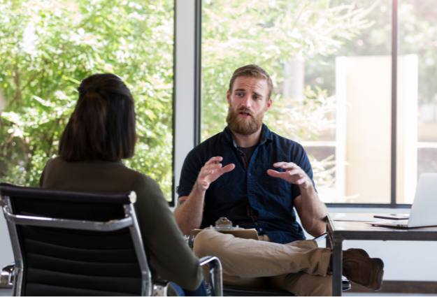 male therapist speaking to client