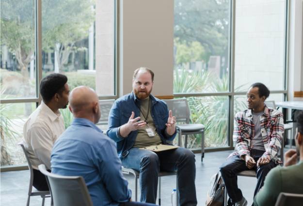 therapist speaking to group