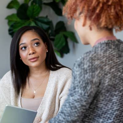 female therapist listening to woman