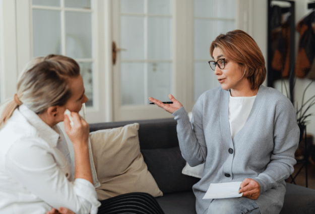 therapist talking to a patient