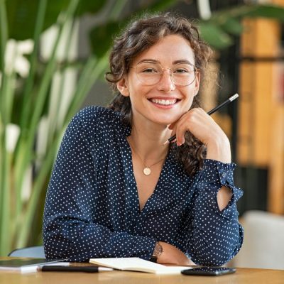 happy woman taking notes