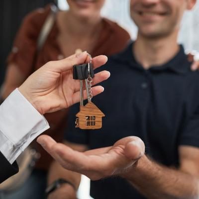 man receiving keys with a smile