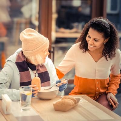 woman helping homeless woman