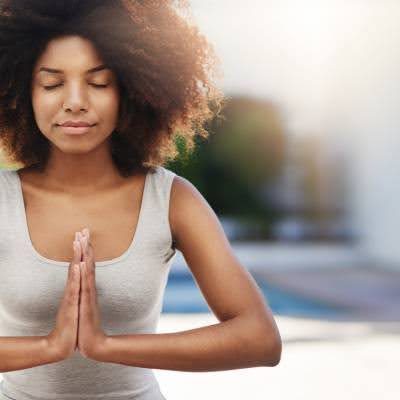 woman holding a prayer pose